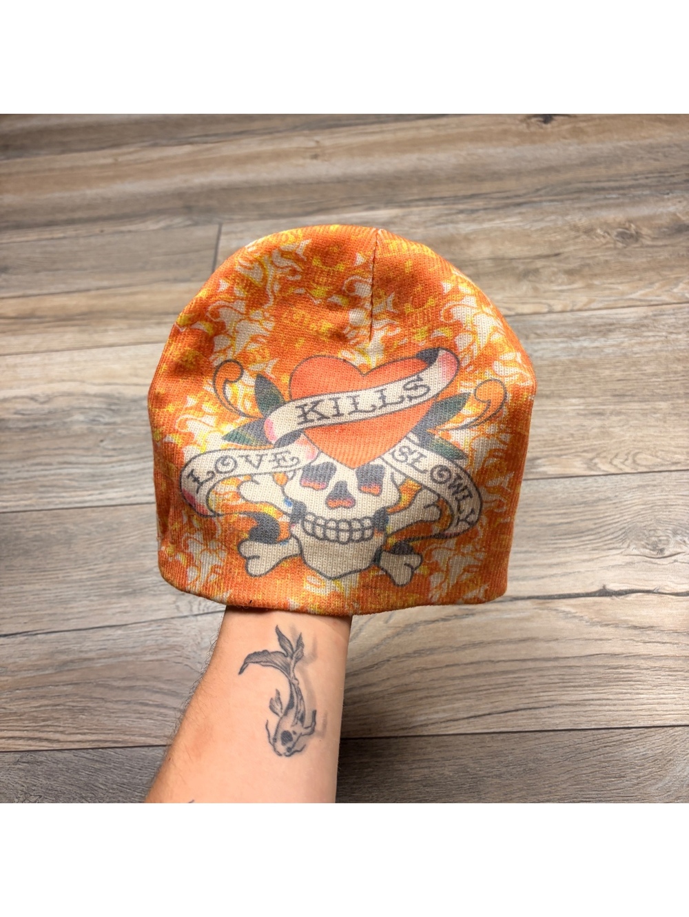 Reversible Orange and Cream Beanie Hat with Skull and Heart Design